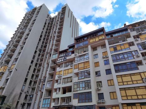 Kyiv, Ukraine - July 10, 2022: A residential building damaged by an russuian rocket in the Kyiv. The rocket hit the house.