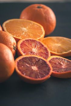 red bloody sicilian oranges on black background