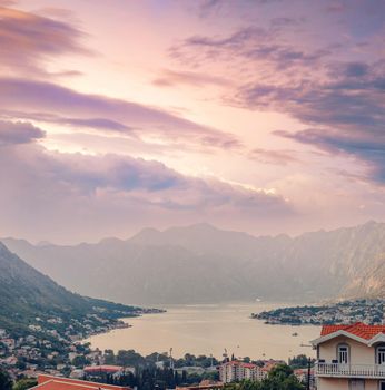 Sunset, beautiful landscape with silhouettes of trees. Travel concept. Montenegro, Kotor Bay. Sunset at Kotor Bay Montenegro. View of the sunset in Boko-Kotor Bay in Montenegro.