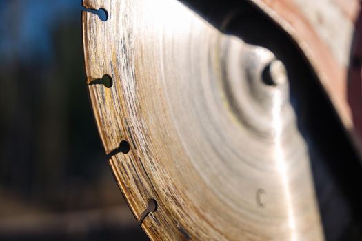 close-up of a saw with a disc for cutting concrete and paving slabs. gasoline hand saw on concrete