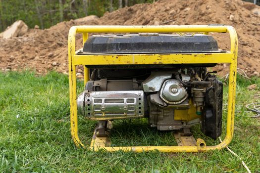 portable gasoline generator operating on a construction site.