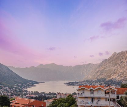 Sunset, beautiful landscape with silhouettes of trees. Travel concept. Montenegro, Kotor Bay. Sunset at Kotor Bay Montenegro. View of the sunset in Boko-Kotor Bay in Montenegro.