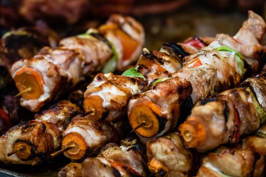 Grilling tasty food on barbecue. Steak, sausages on grill at food festival