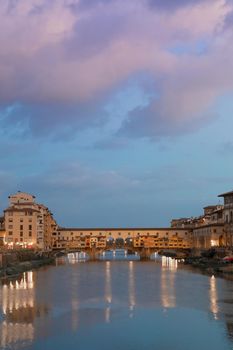 Florence, Italy - circa July 2021. Sunset light on Ponte Vecchio - Old Bridge.
