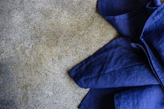 Kitchen textile towel on concrete table background with copy space