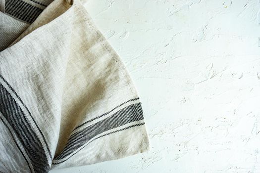 Kitchen textile towel on concrete table background with copy space