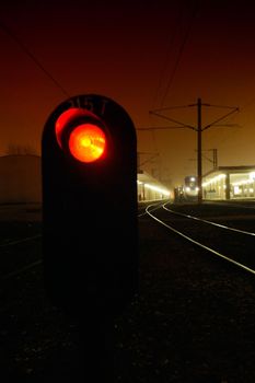 Red light on the railroad at night