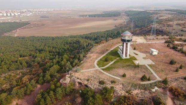 29 December 2020 Eskisehir Turkey. Scenery tower in Eskisehir city forest among the pine trees aerial drone view