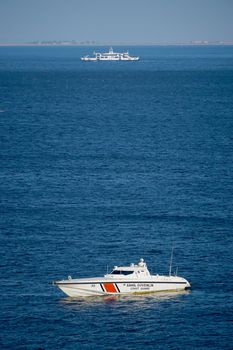 22 July 2021 Izmir Turkey. Coast guard boat and ferry in the same scene in the morning