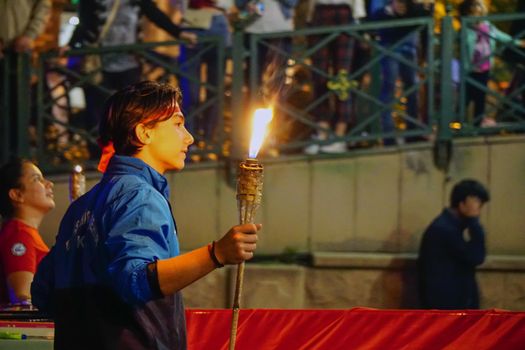 19 May 2019 Eskisehir Turkey. Young boy holding fire torch that symbolises the independence of Turkish nation on 19 May National Independence Parade
