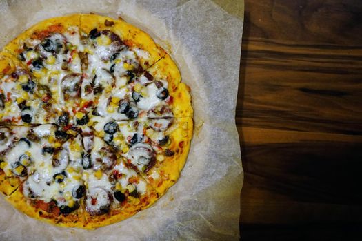 Homemade delicious pizza close up view