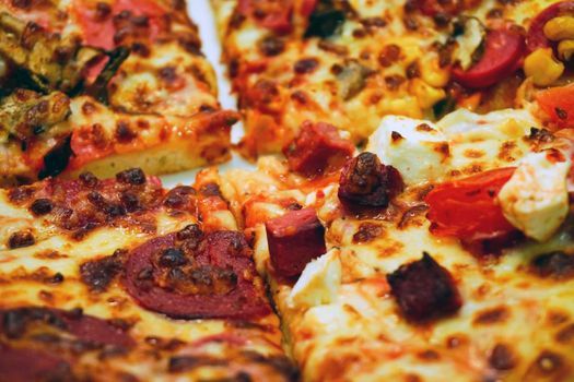 Homemade pizza and french fries on wooden table