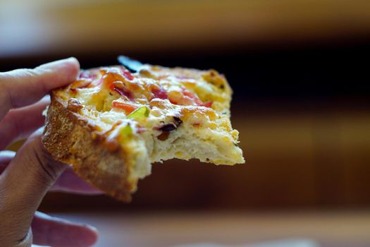 Home made breakfast pizza close up view with shallow depth of field