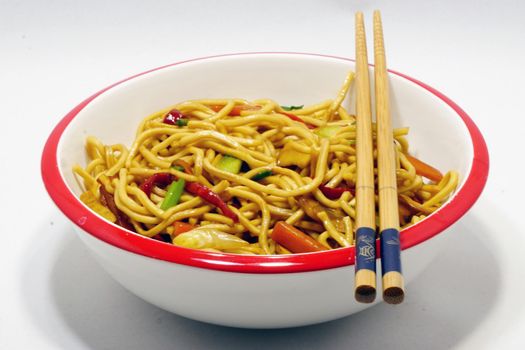 Chinese noodle in the dish on white isolated background