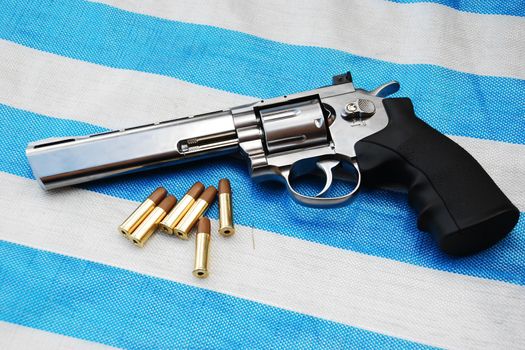 Airgun on white blue background close up view