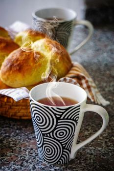 Homemade fresh tea and bread close up view