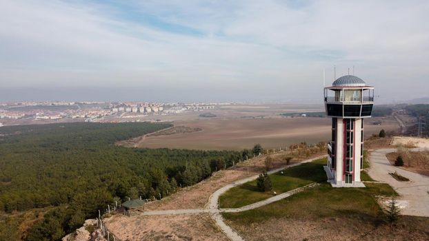29 December 2020 Eskisehir Turkey. Scenery tower in Eskisehir city forest among the pine trees aerial drone view