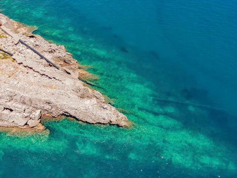 The pipe drains the sewer into the sea. Environmental pollution. Drone view.