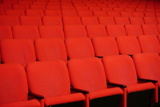 Red theater seats in a row