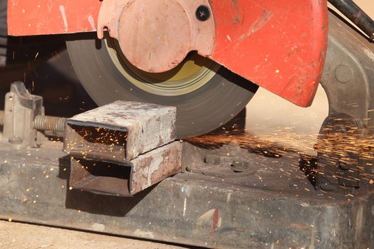 cutting a metal and steel with compound mitre saw with sharp, circular blade