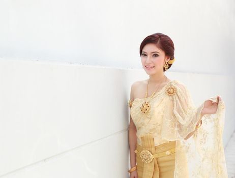 woman with Thai dress and wall background