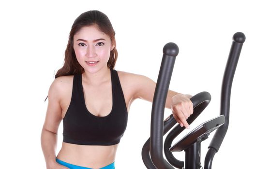 young woman doing exercises with exercise machine, on white background