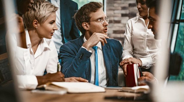 Brainstorming Of Business People In Office, Team Of Young People Hotly Discussing Startup Project, Confidence Colleagues, Male And Female White Collar Workers, Sitting At Office Table, Toned Image