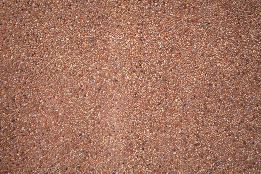 brown small granite stone wall background texture