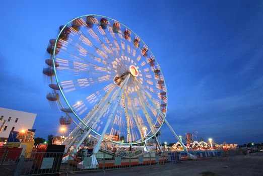 Ferris Wheel(motion) at amusement park at twilight time