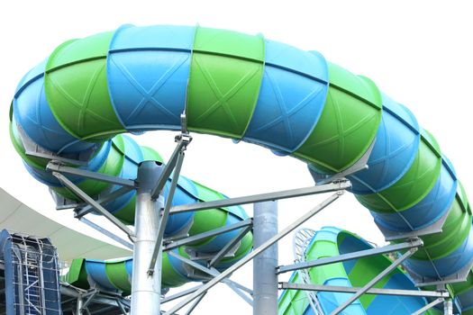 Slider in swimming pool with sky background