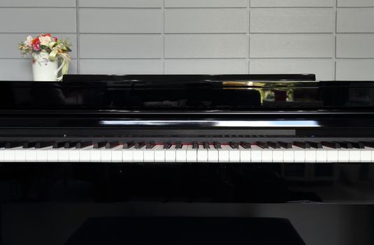 A black electronic piano with piano keys