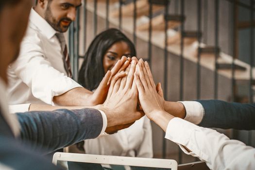 Multi Ethnic Group Giving High Five At Meeting Office, Diverse Business Team Of White Collar Workers Celebrating Success Joined Hands Together In Unity Sign, Toned Image