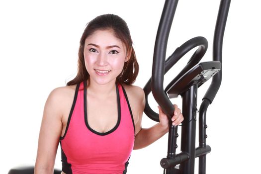 young woman doing exercises with exercise machine, on white background