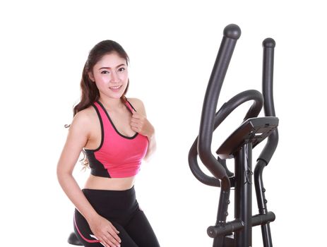 young woman doing exercises with exercise machine, on white background