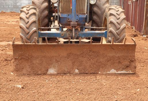 Close-up Tractor plow on red  soil, Thailand