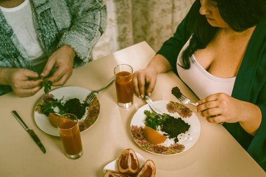 Body Positive Man And Woman Going To Eat Healthy Food, Selective Focus On Woman In Casual Clothes Holding Fork In Foreground And Picking Salad From Plate, High Angle View