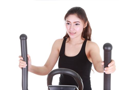 young woman doing exercises with exercise machine, on white background