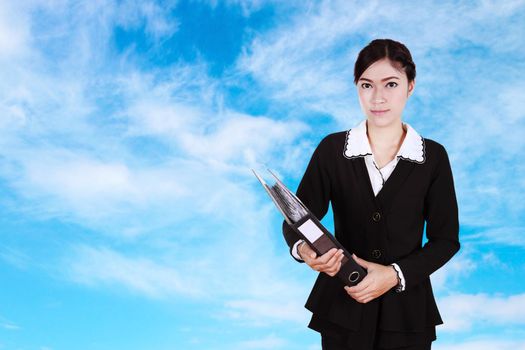 business woman holding folder documents with sky background