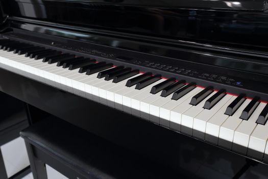 A black electronic piano with piano keys