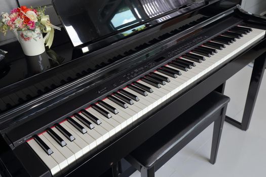 A black electronic piano with piano keys