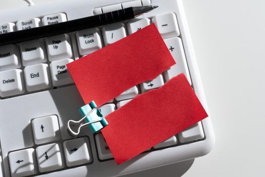 Ripped Sticky Note With Important Messages Over Keyboard And Pen On Desk.