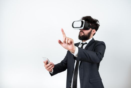 Man Wearing Vr Glasses And Pointing On Important Messages With One Finger.