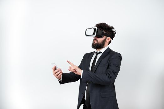 Man Wearing Vr Glasses And Pointing On Important Messages With One Finger.