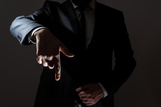 Businessman In Suit Pointing With One Finger On Important Message.