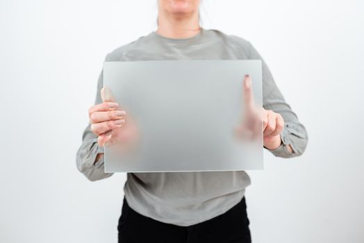 Businesswoman Holding Blank Placard And Advertising The Business.