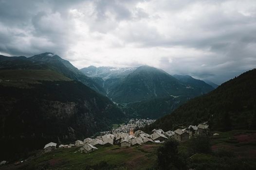 Mountain landscape with a little town - Italian Alps.