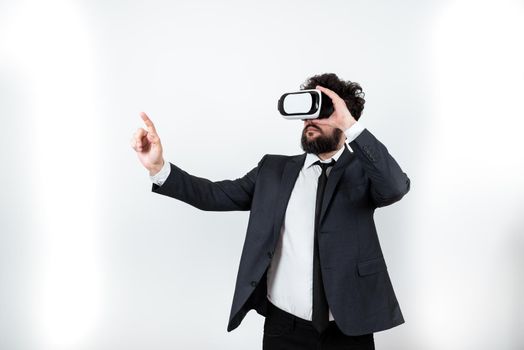 Man Wearing Vr Glasses And Pointing On Important Messages With One Finger.