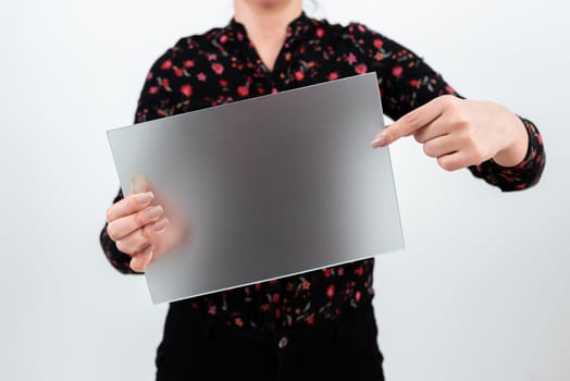 Woman Pointing At Placard And Presenting New Ideas For Marketing.