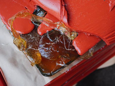 Melted red gelatin close-up. Abstract image of gelatin waste in pharmaceutical production. Wastes from the production of gelatin.