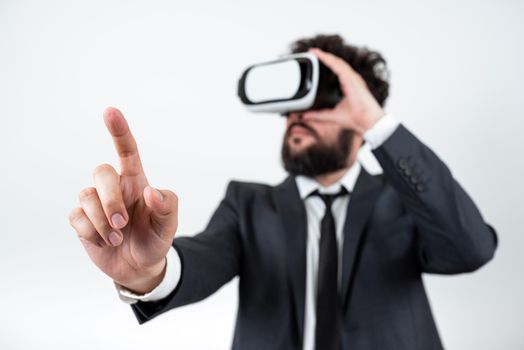 Man Wearing Vr Glasses And Pointing On Important Messages With One Finger.